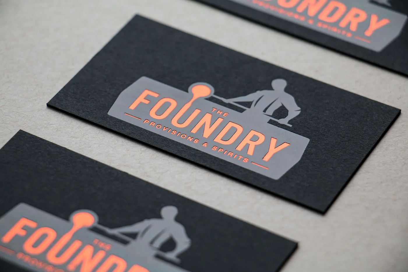 Black foil stamped business cards on black paper