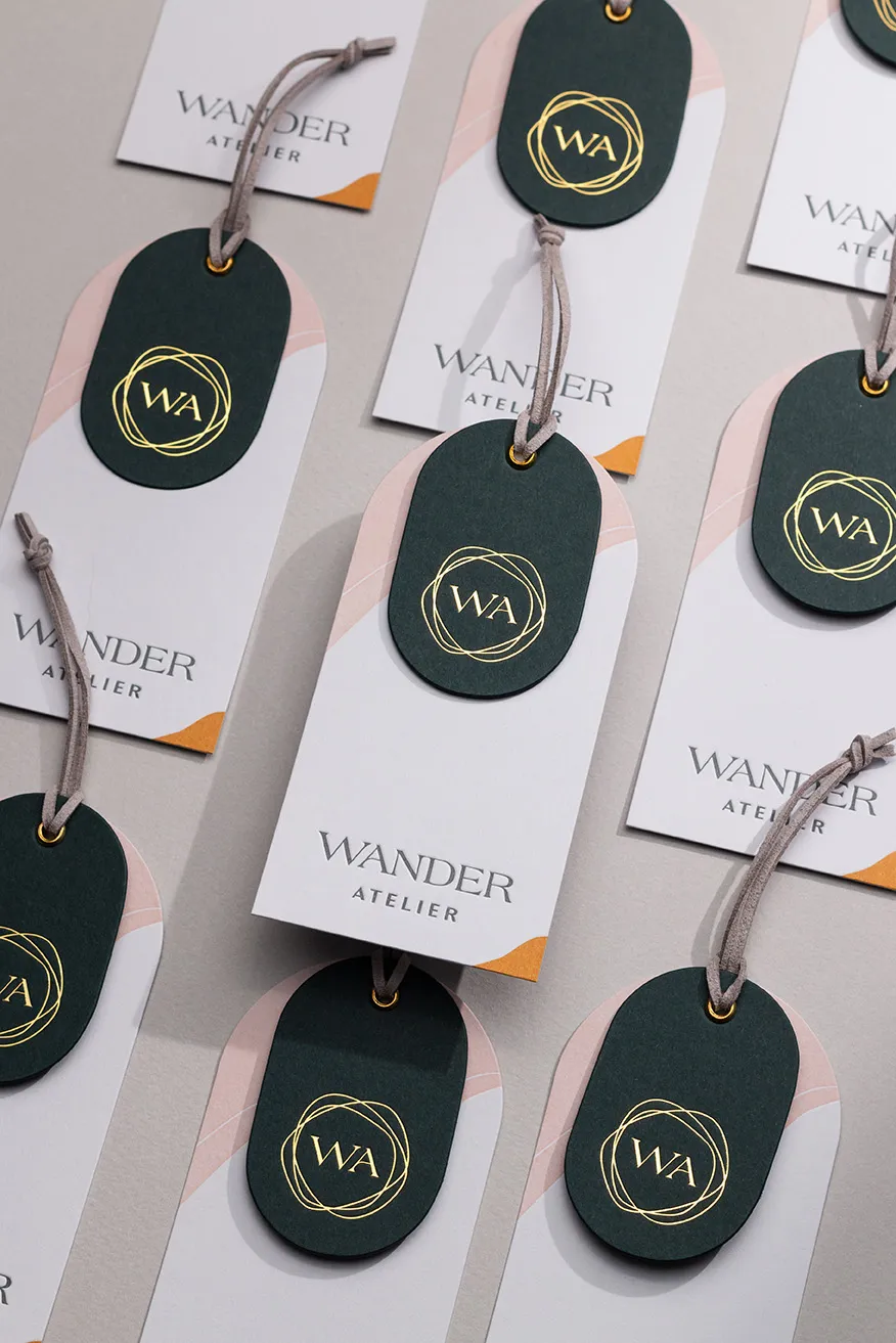 Letterpress and foil hang tags with gold eyelets